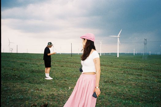 Stylish depiction of individuals at a wind farm in Inner Mongolia, China.