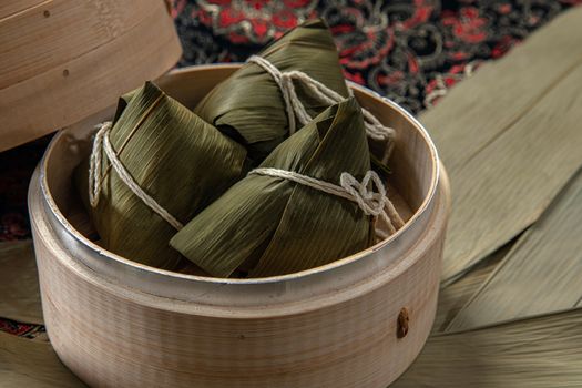 Delicious Taiwanese zongzi in a bamboo steamer, showcasing traditional Asian cuisine.
