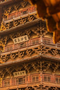 Detailed view of an ancient wooden pagoda in Shaanxi, showcasing intricate architectural details.