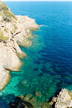 Breathtaking aerial view of rocky coastline and turquoise waters on the French Riviera in summer.