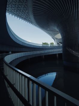 Stunning modern architecture with dynamic curves and reflections.