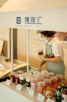 Explore a vibrant Nanjing tea house offering a variety of colorful drinks and artisanal teas.
