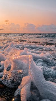 Stunning sunset on Rize beach with waves crashing and golden sky.