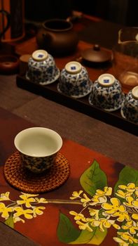 Elegant display of porcelain tea cups for a traditional Chinese tea ceremony.